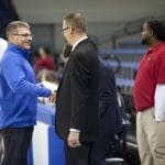 Dave Bechler congratulates Coach Chad Seibert after the boys varsity basketball state final win, 2019.