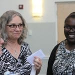 Mrs. Maria Archer visits with parents after the ceremony