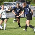 Halie Mast '21 and Abby Stapleton '19 cover Fredericksburg Christian's Emma  Jones. Jim Sacco DN-R