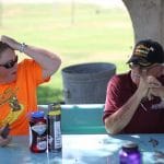 Jennifer Young, who drove the food and supply van for Discovery 2019 and '17, confers with bus driver Barry Darr over a lunch break in Yuma, Arizona.