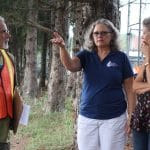 Kendal Bauman, Maria Archer and Lynette Mast consult about the elementary playground plans