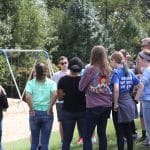 Seventh grade earth science class discusses how to incorporate salvaged tires into the elementary playground