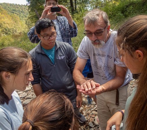Science teacher Lee Good with environmental science students exploring the North Fork. Photo by Steven Johnson.