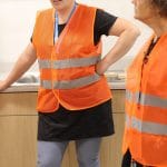 Heidi Byler, grade 3 and Lynette Mast, K, are happy to hear about the kitchen with lots of work space, sinks at child level and more.