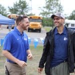 Justin King, high school principal, and Paul Leaman, head of school at the  2019 EMHS cross country invitational.