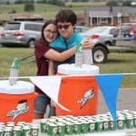 Emily '23 and Eli '21 Hess manage the water and Gatorade at the end of the race at the  2019 EMHS cross country invitational.