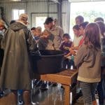 Sixth graders at fish hatchery