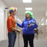 Zach Sauder (7th grade social studies) and Maria Archer (K-8 principal) wear outfits created by students who bought the right to dress them on auciton