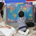 Babar family visit to kindergarten room to talk about their home country of Pakistan and share some special food.