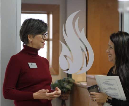 Admissions counselor, Marsha Thomas, chats with a parent.