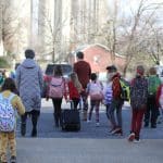 EMES students move some supplies into the school before the big move.