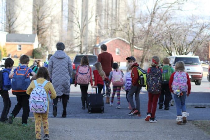 EMES students move some supplies into the school before the big move.