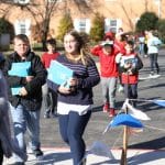 Elementary students take loads of supplies to the new school on Dec. 4 and 5