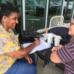 Debbie Katz, high school counselor, and Maria Archer, then K-8 principal, plan for a meeting of the Racial Equity Working Group (later renamed the Equity Work Group).
