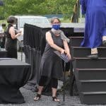 Jodi Herzler, senior class sponsor, preparing a diploma for socially safe pick up...Commencement 2020