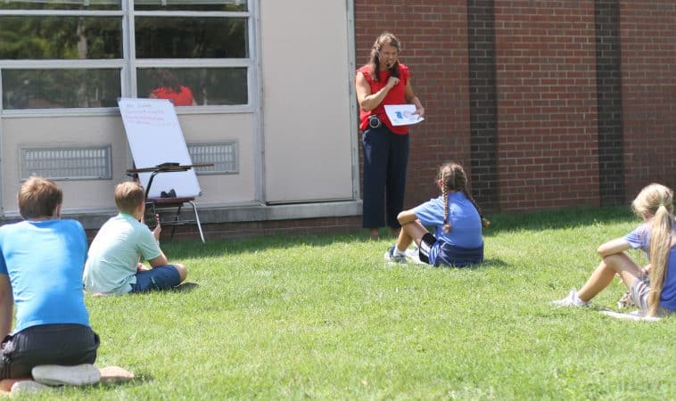 Rebecca Yutzy teaches a 7th grade Spanish class outside.