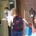 Reviewing schedules while waiting for health screen