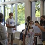 Middle school students enter through the Auditorium foyer