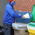Kendal Bauman, faculty club sponsor, brings elementary school compost to the main collection bins each week.