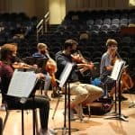Nov. 23, orchestra performs for the faculty and staff, in the balcony