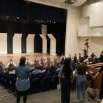 Benediction closing song with alumni choir members joining the circle