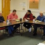 Anthony Khair  (red flannel) of Mennonite Central Committee with students at EMU.