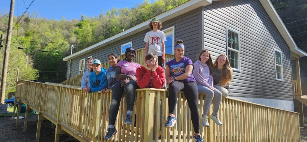 MDS E-term in Hurley, Va. Center left in pink shirt, Fortuna Chipeta. To her right in red is Lewis Yoder.