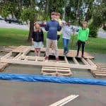 MDS students celebrate the #th and final wall they constructed for a home in Hurley, Va.