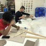 Students create raku ceramic tile quilt squares