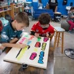 Title: Cozy Fire
Size: 24”x18”
Medium: acrylic paint
Description: 4th grade artists brainstormed and voted on an inspirational saying to serve as the centerpiece of their painting. Next, they collaborated to determine the color scheme and design. This was an important exercise in both sharing and listening respectfully. Students worked in small groups to draw and paint the composition. As the final step in their creative process, the class brainstormed title ideas for their piece then voted for their favorite.
