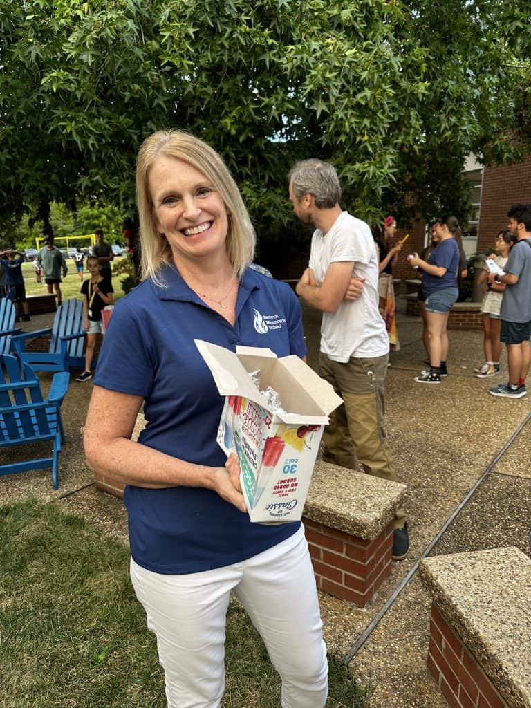 Kirstin Fink hands out popsicles at a back-to-school night