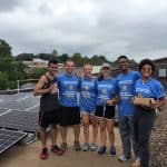 Everett with friends from Graduate School helping install solar panels during a Solar Barn Raising at EMU, September 2018